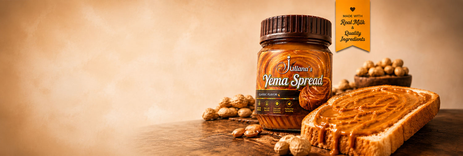 Jar of Juliana's Classic Yema Spread with a slice of toast and peanuts on a wooden table
